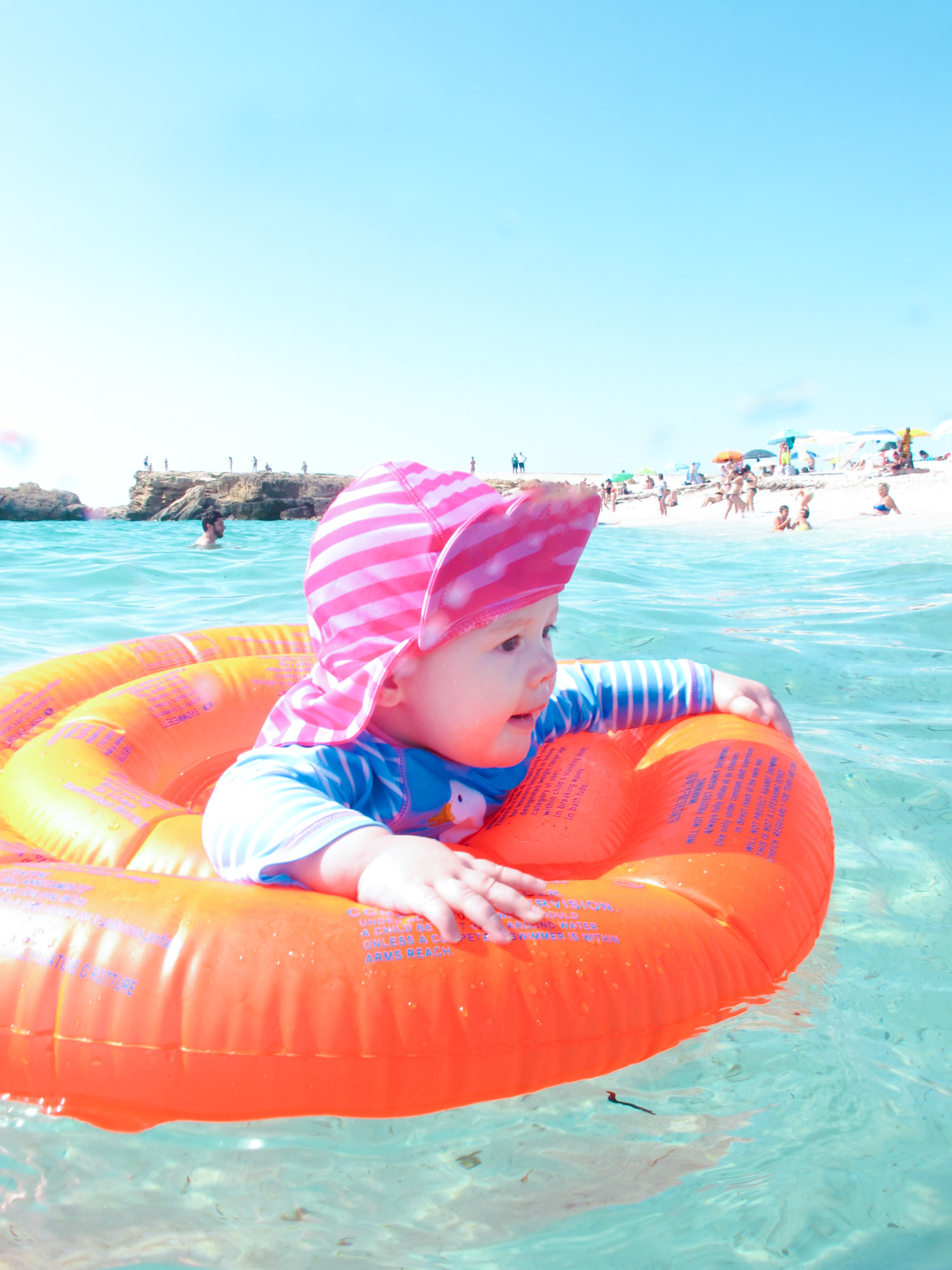 Baby swimming in the sea