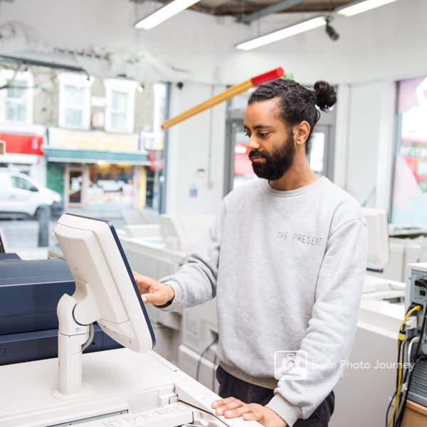 commercial photography staff operating a printing machine